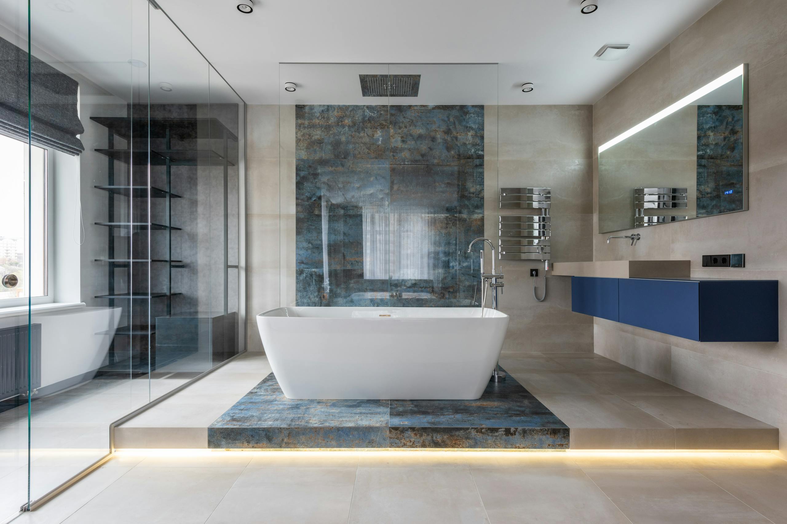 Elegant bathroom featuring a ceramic freestanding tub and contemporary design elements.